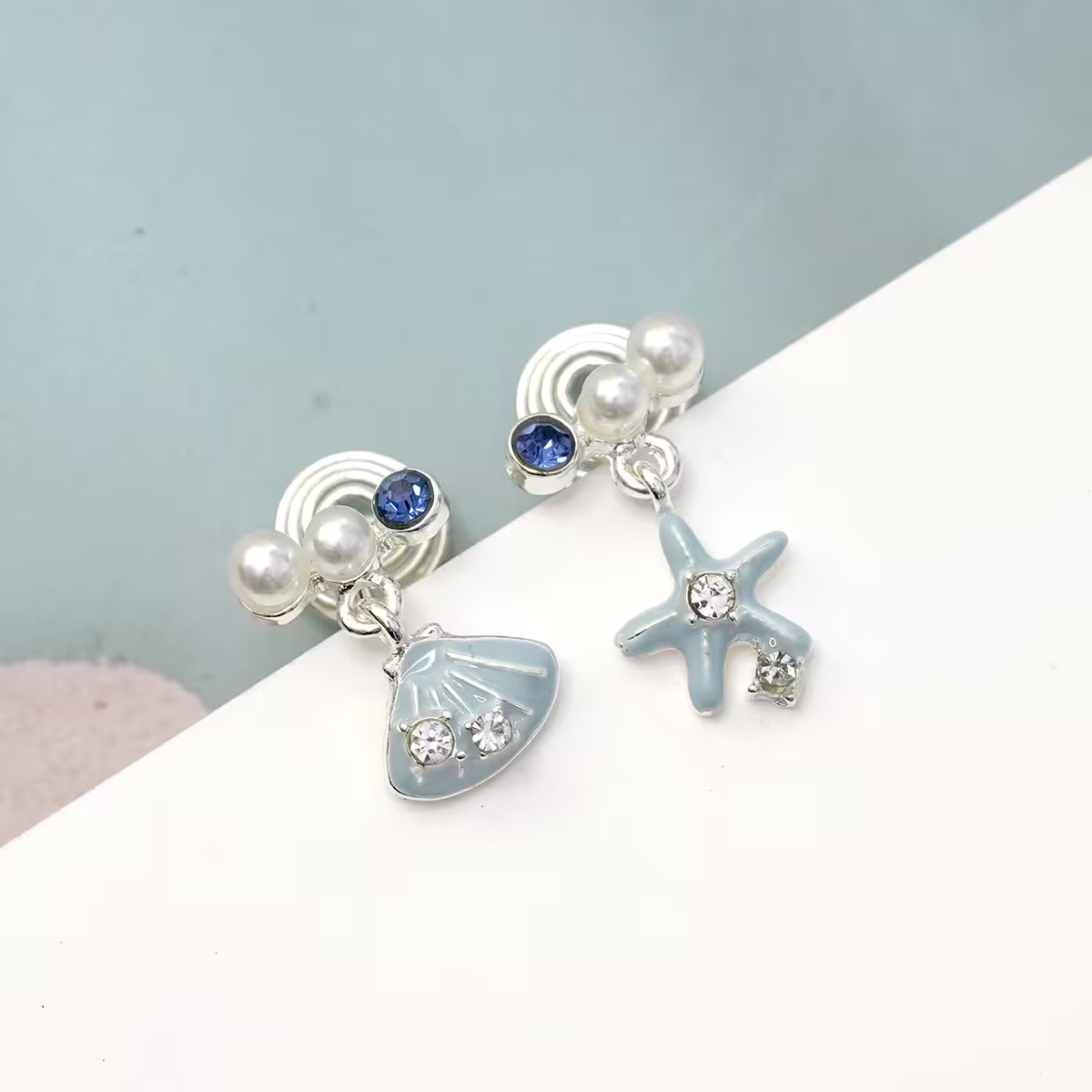 水藍海星貝殼&times;不對稱蚊香盤U型耳夾-第1張